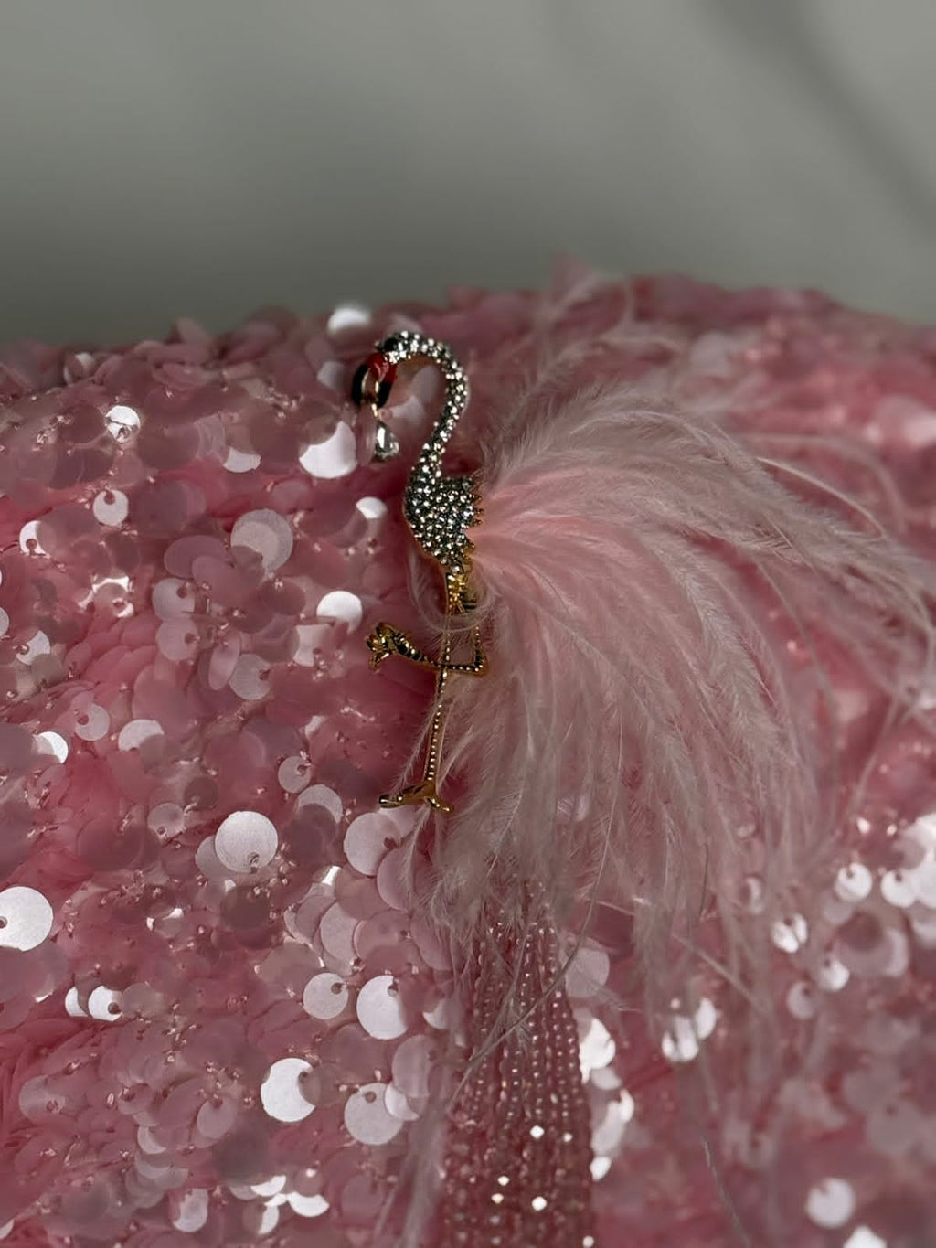 Pink sequin clutch with flamingo