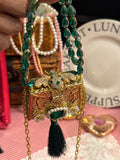 Green bug clutch with tassel