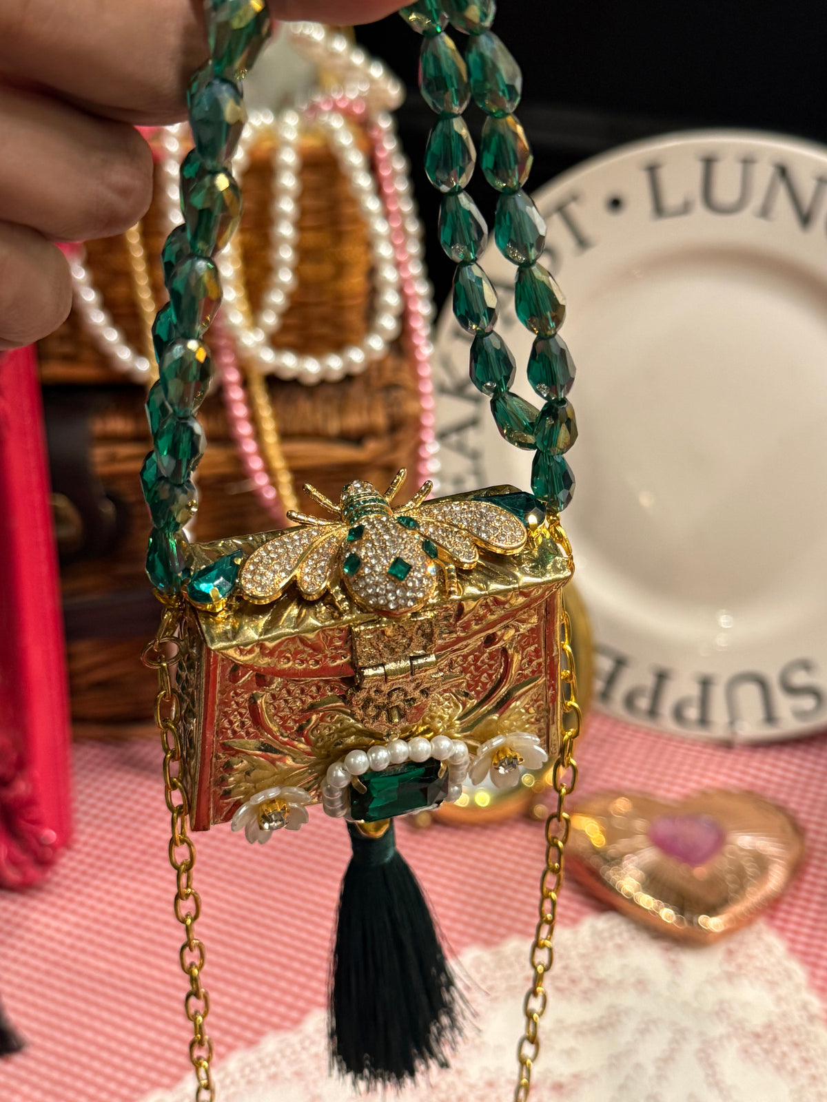 Green bug clutch with tassel