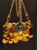 Gold faux sequin mini clutch with peacock embellishments