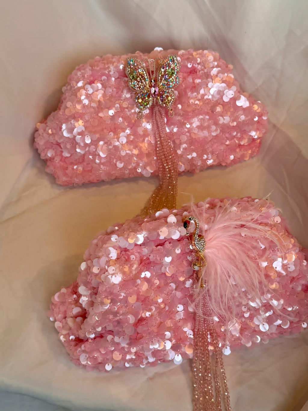 Pink sequin clutch with flamingo