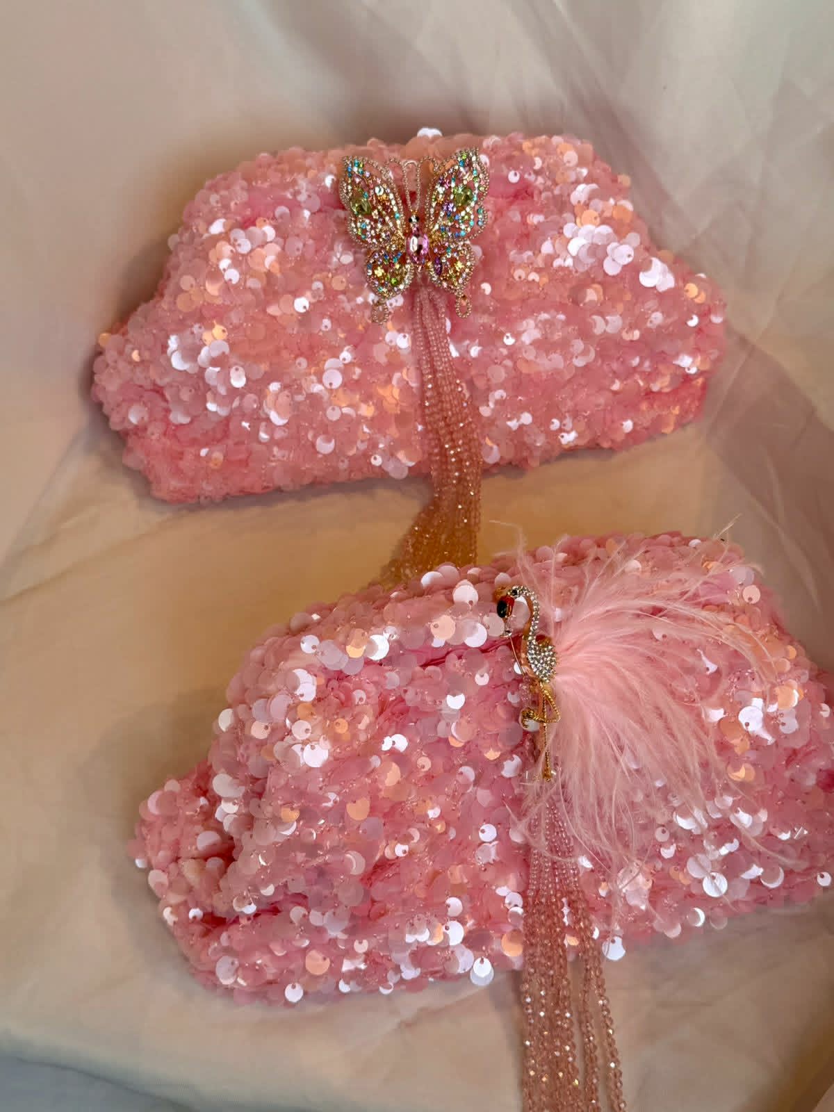 Pink sequin clutch with flamingo
