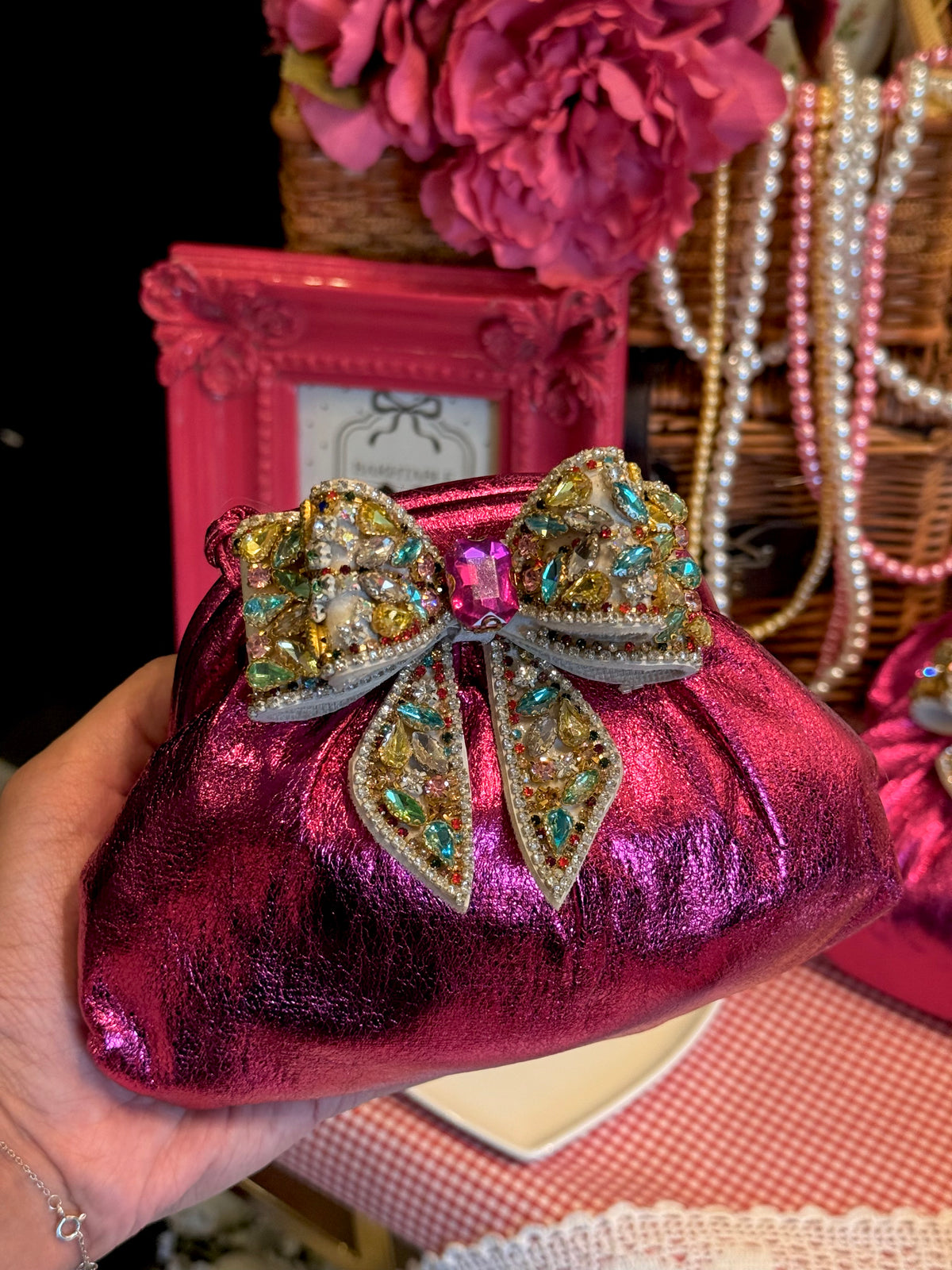 Hot pink clutch with multi rhinestone bow