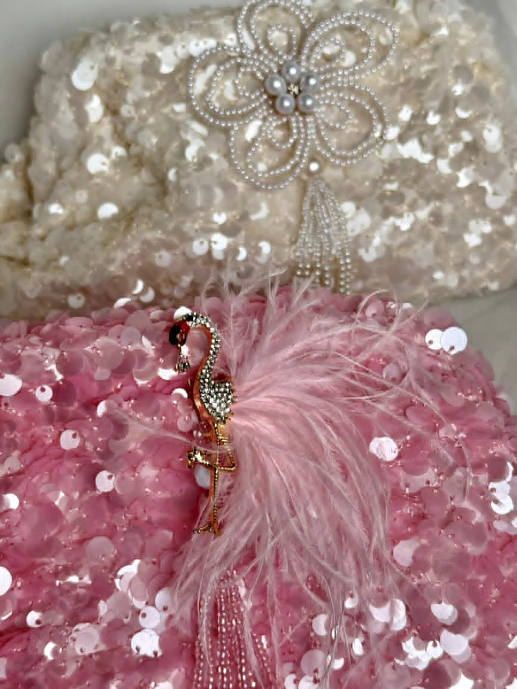 Pink sequin clutch with flamingo