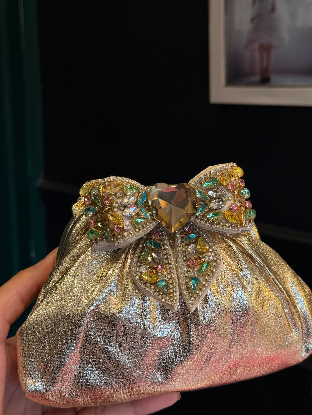 Gold clutch with multi colour bow