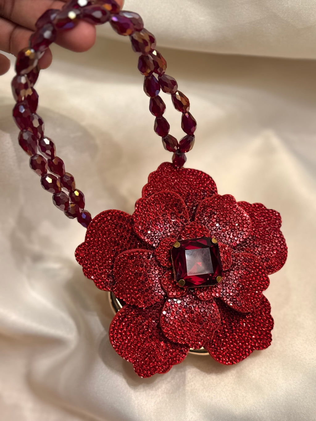 Maroon rose flower clutch
