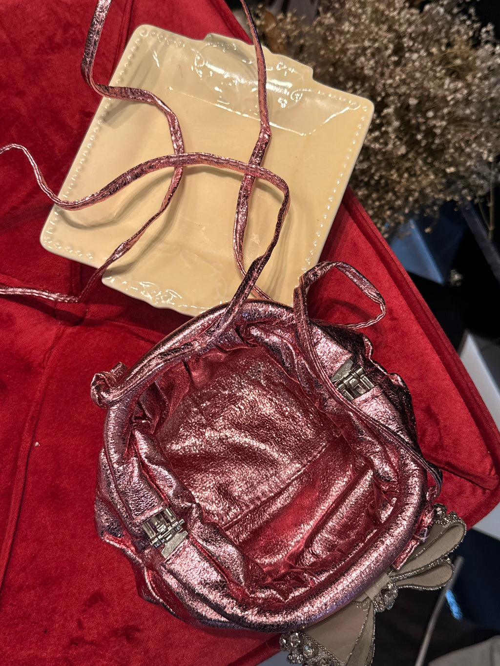 Baby pink clutch with bow embellishments