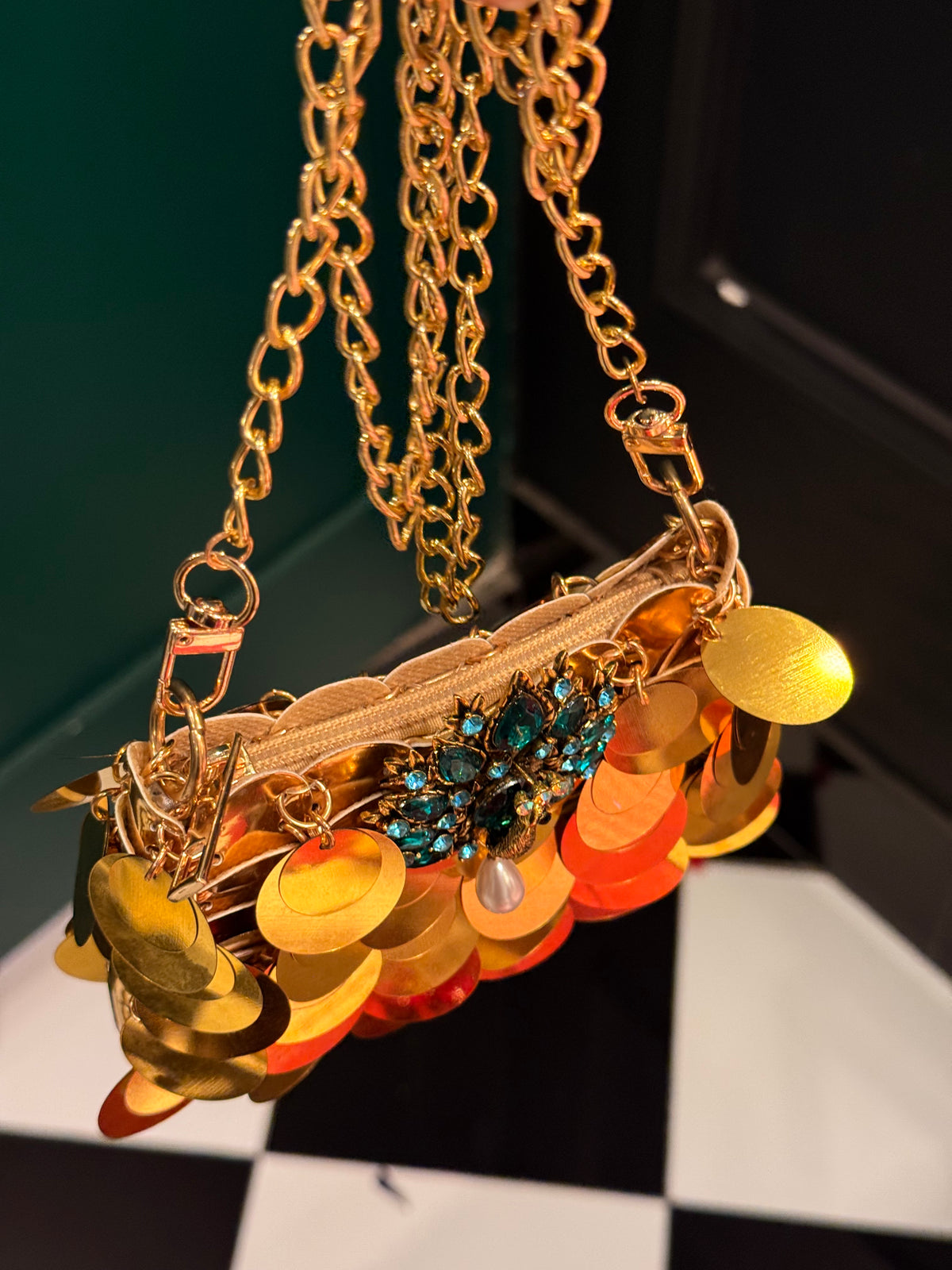Gold faux sequin mini clutch with peacock embellishments