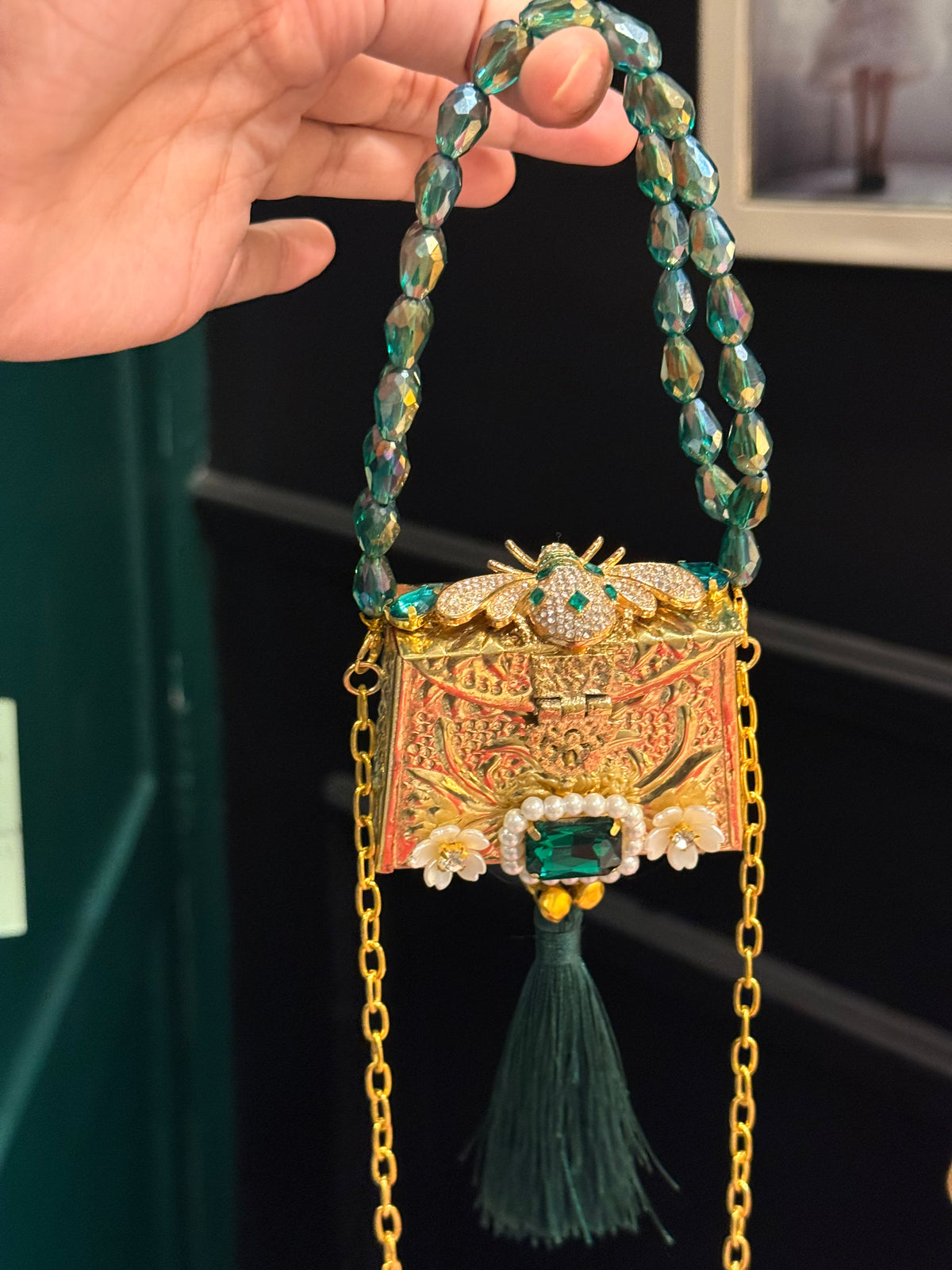 Green bug clutch with tassel