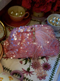 Pink sequin clutch with flamingo