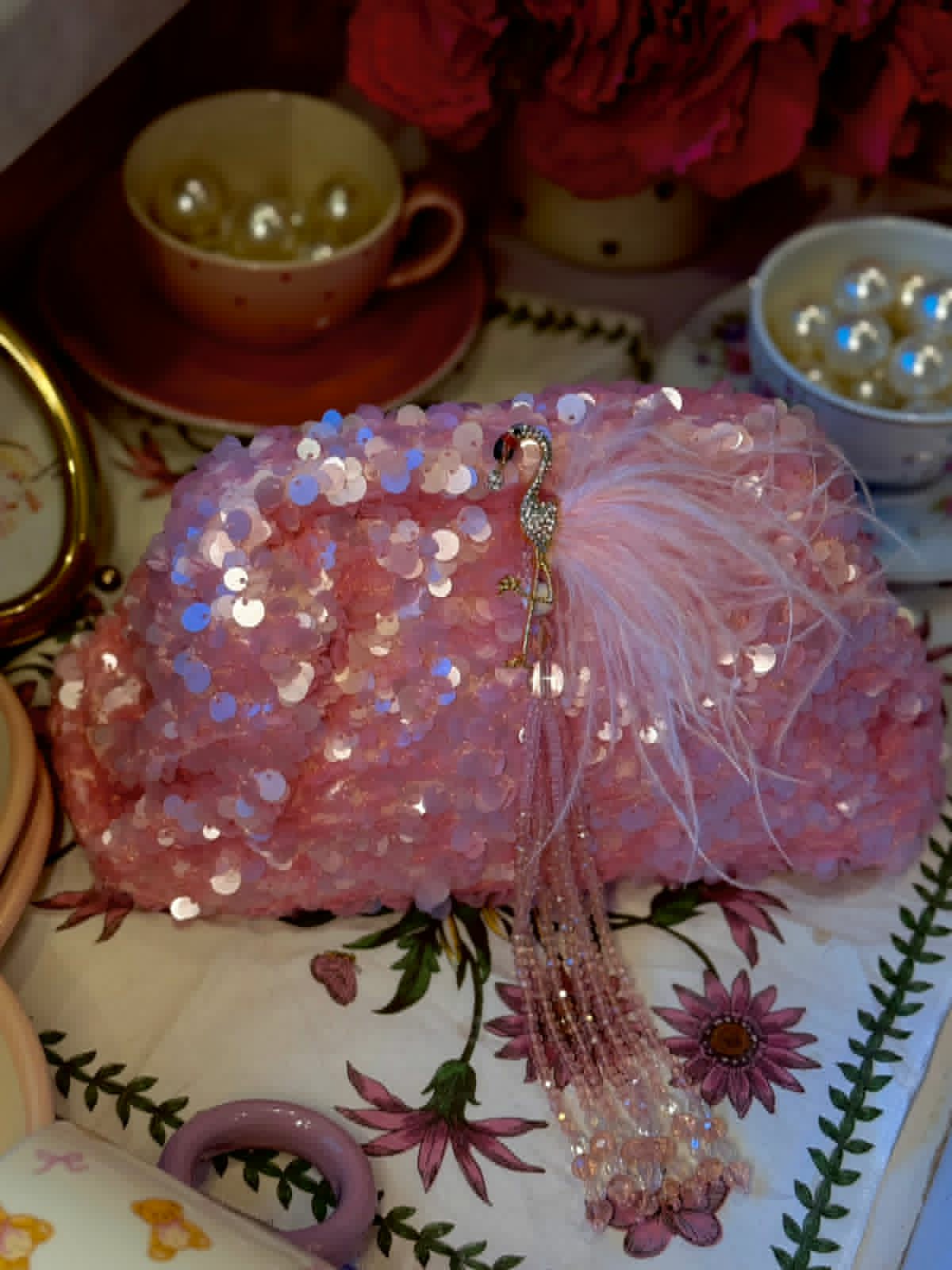 Pink sequin clutch with flamingo
