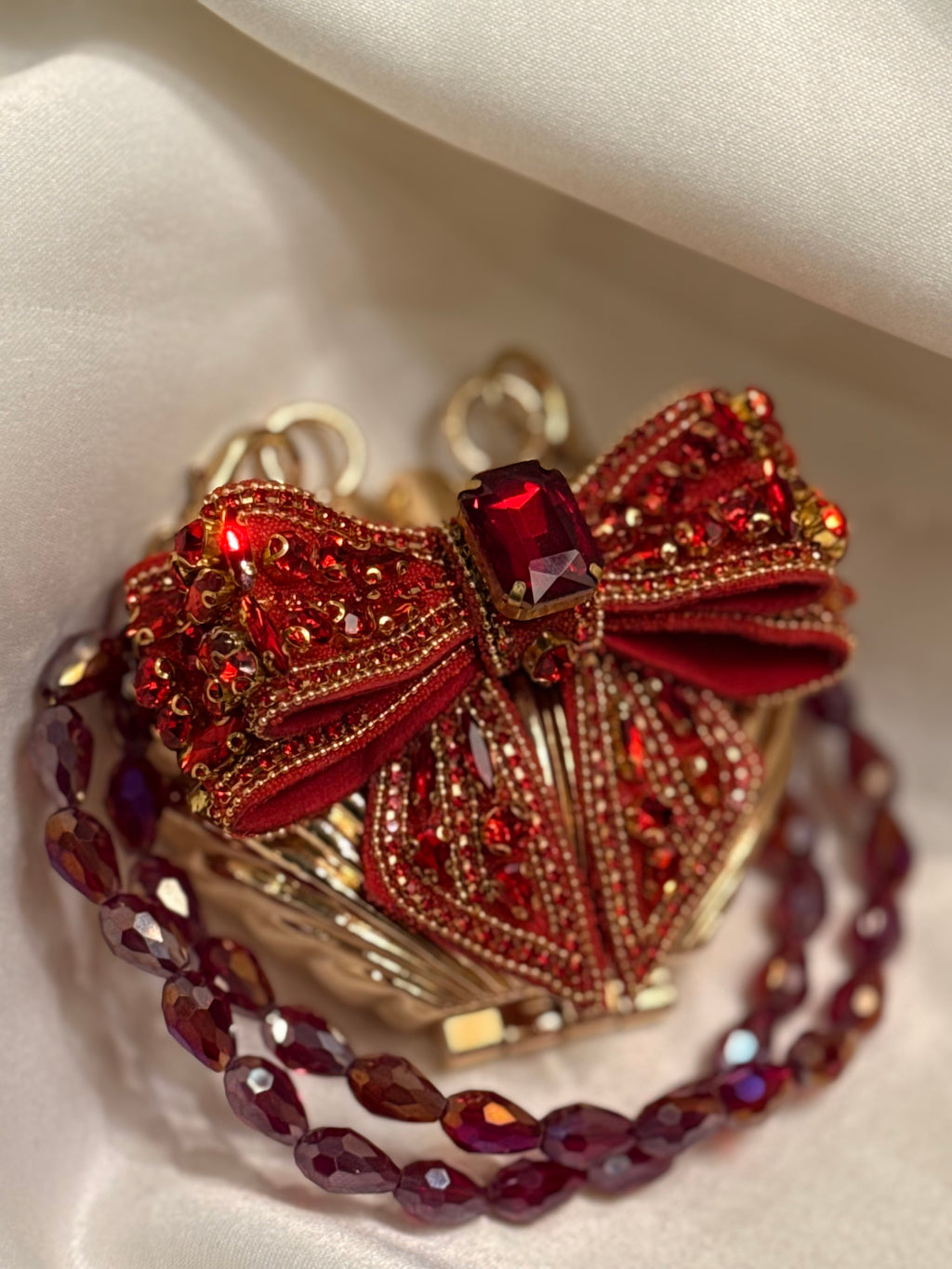 Maroon bow clutch