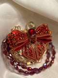 Maroon bow clutch