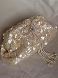 Pearly offwhite sequin clutch