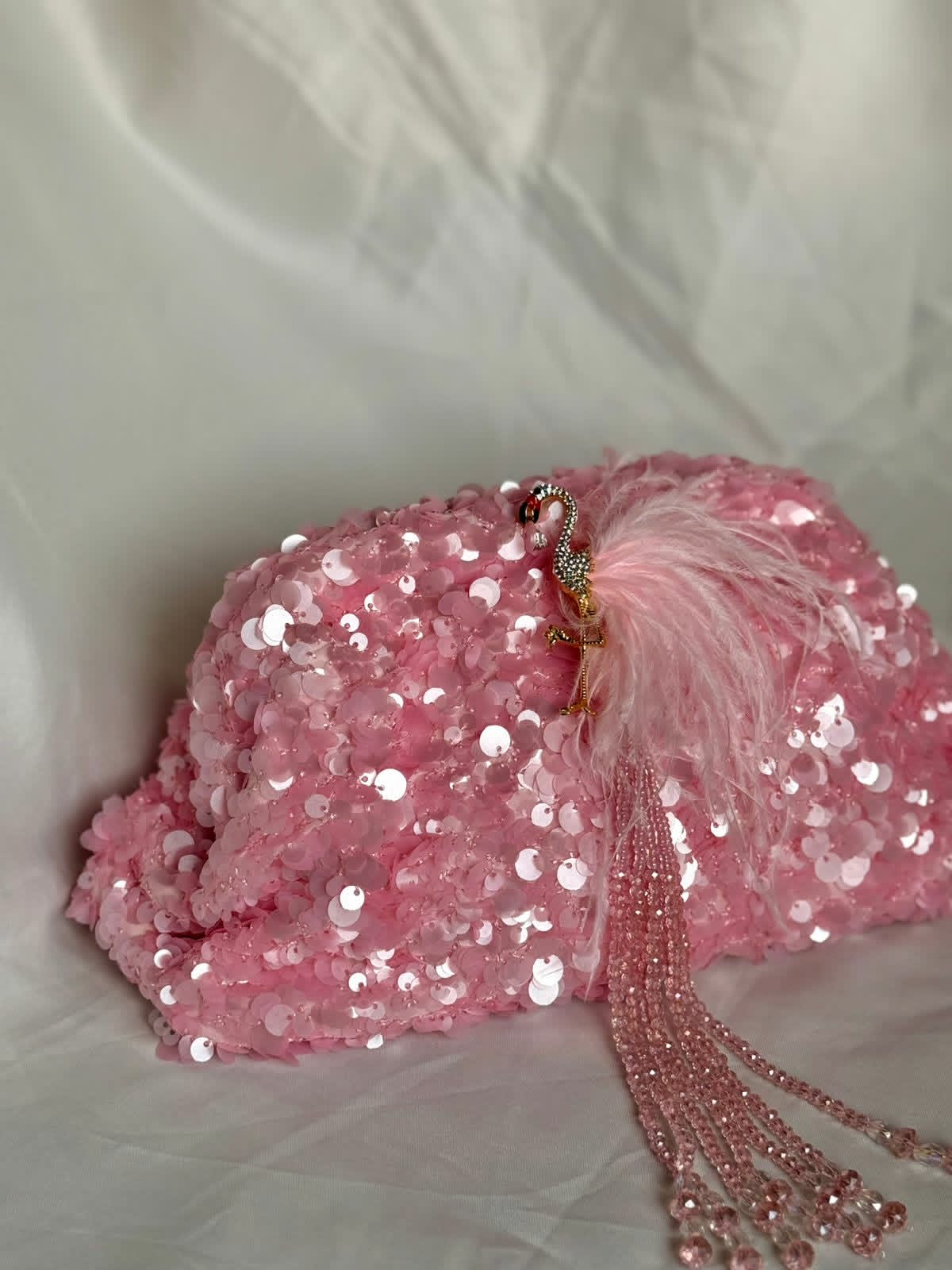 Pink sequin clutch with flamingo
