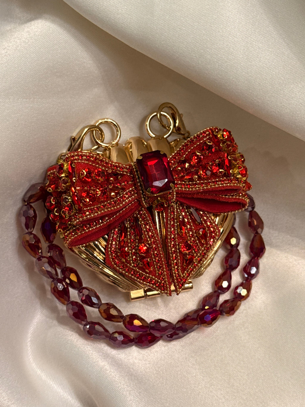 Maroon bow clutch