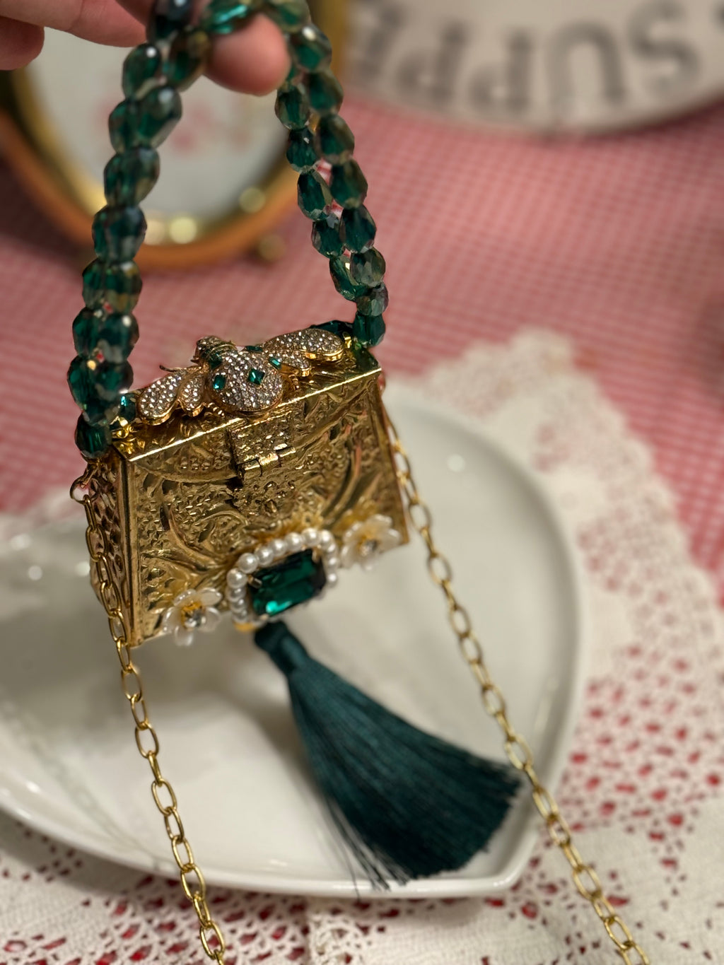 Green bug clutch with tassel