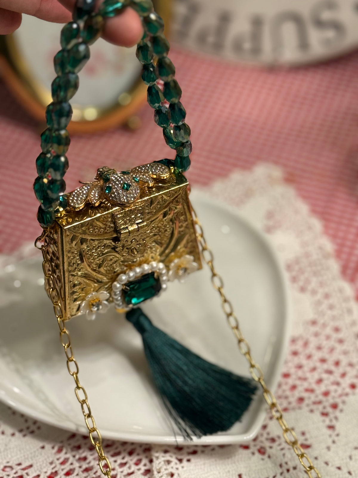 Green bug clutch with tassel