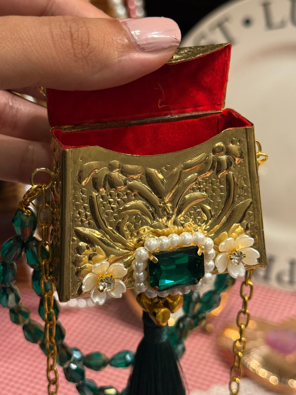 Green bug clutch with tassel