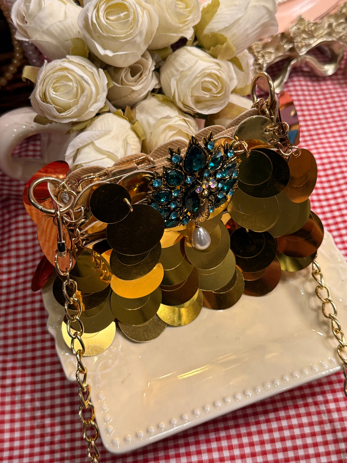 Gold faux sequin mini clutch with peacock embellishments