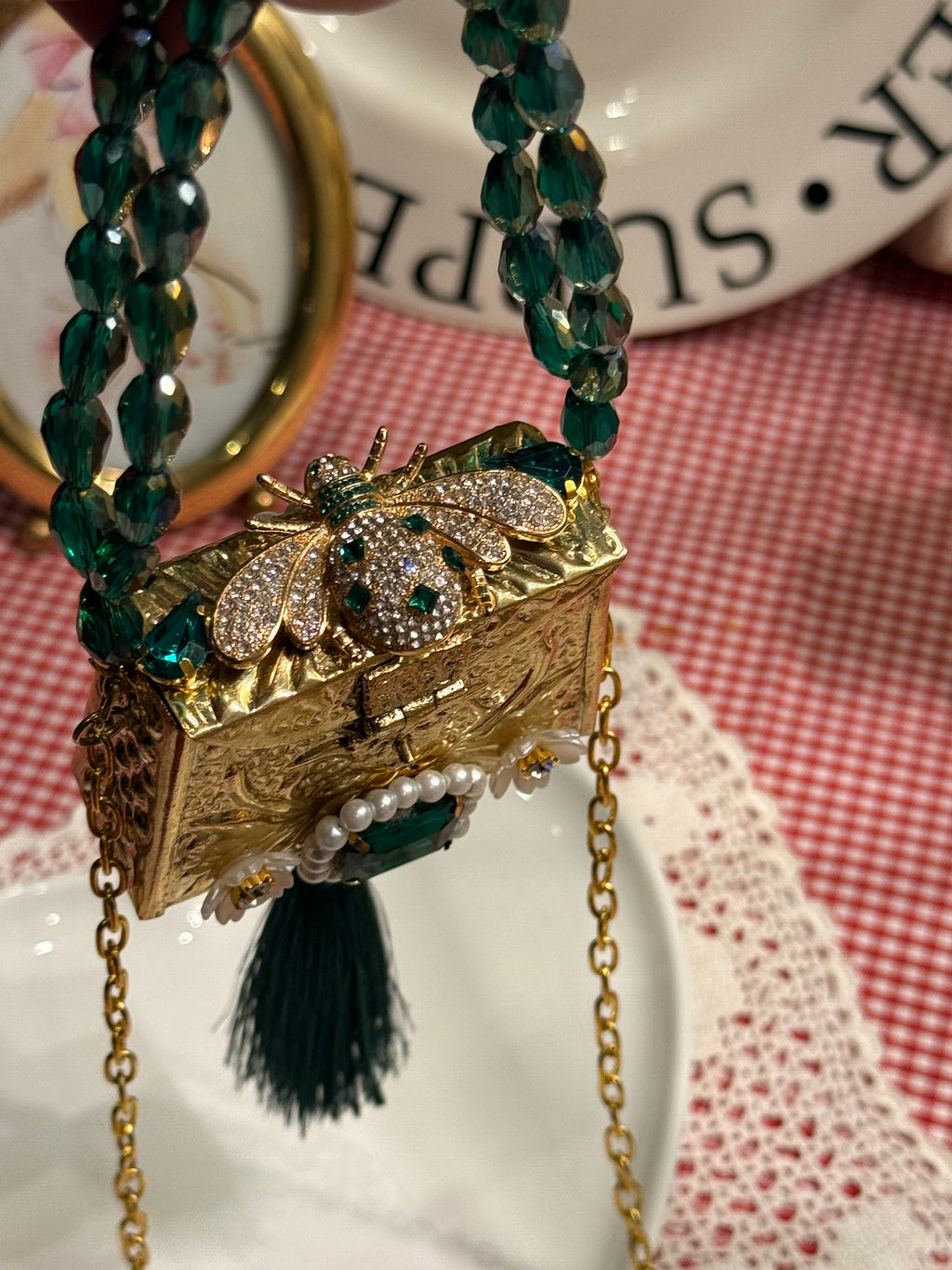 Green bug clutch with tassel