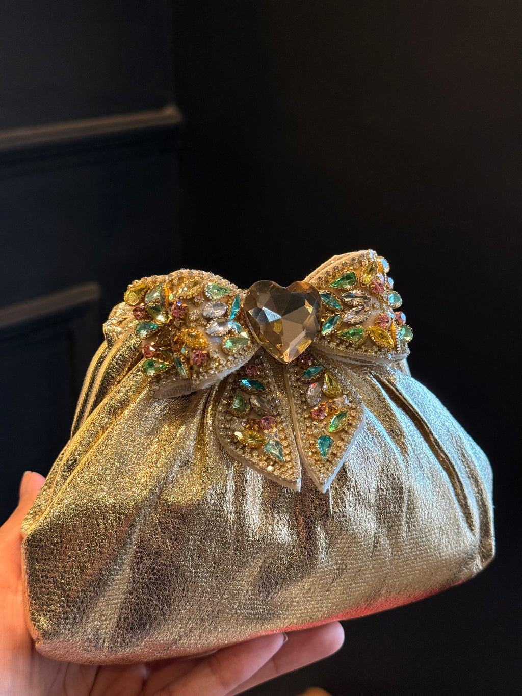 Gold clutch with multi colour bow