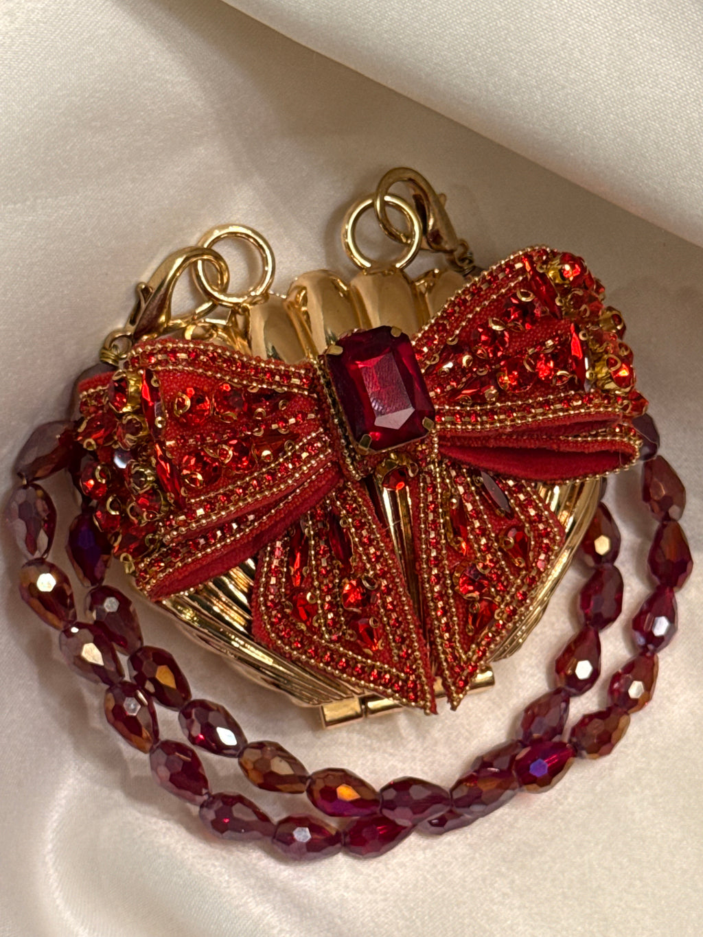 Maroon bow clutch