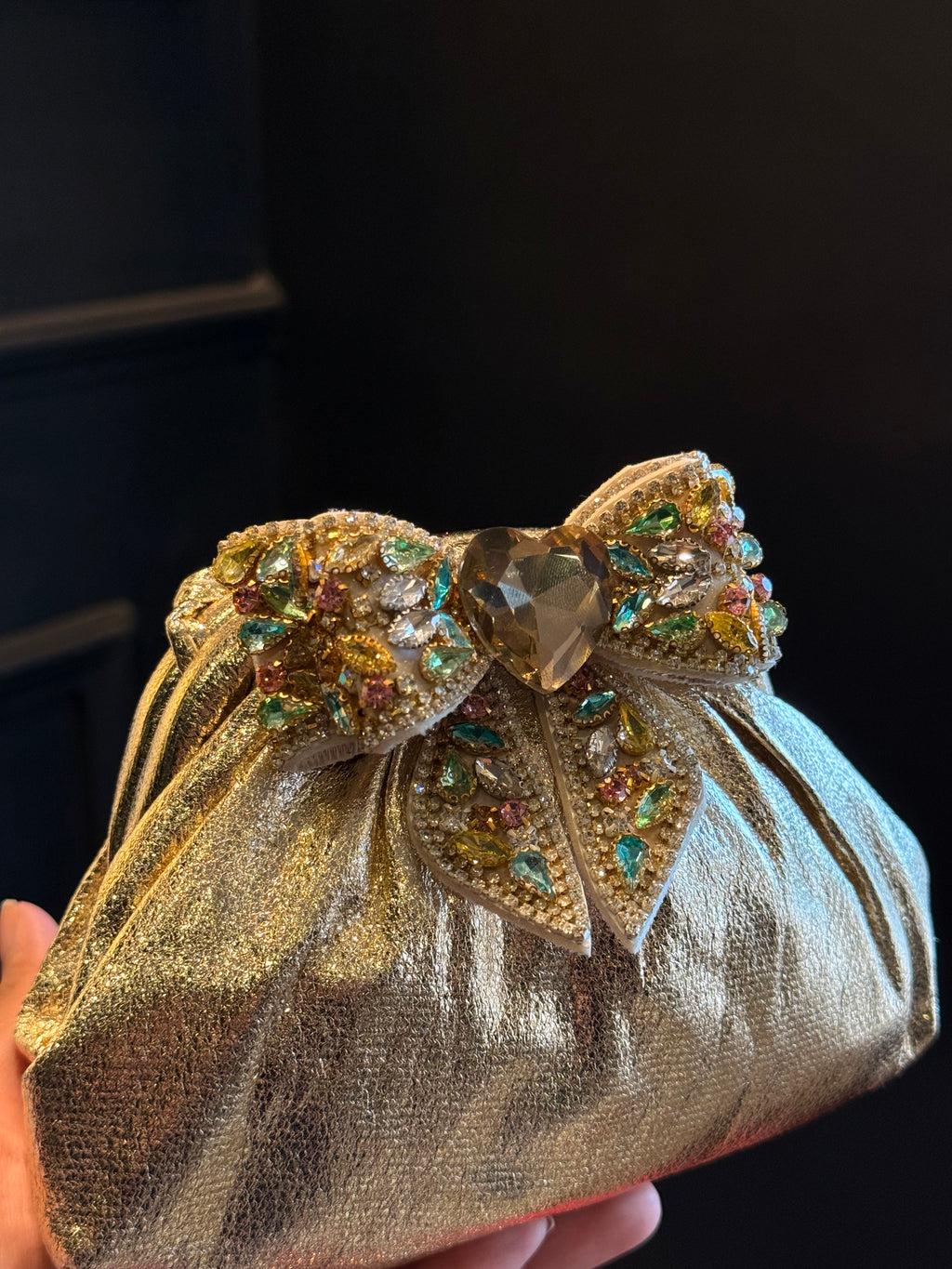 Gold clutch with multi colour bow