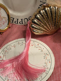 Shell clutch with long pink tassel