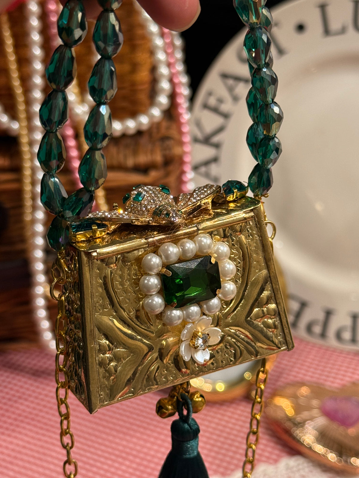 Green bug clutch with tassel