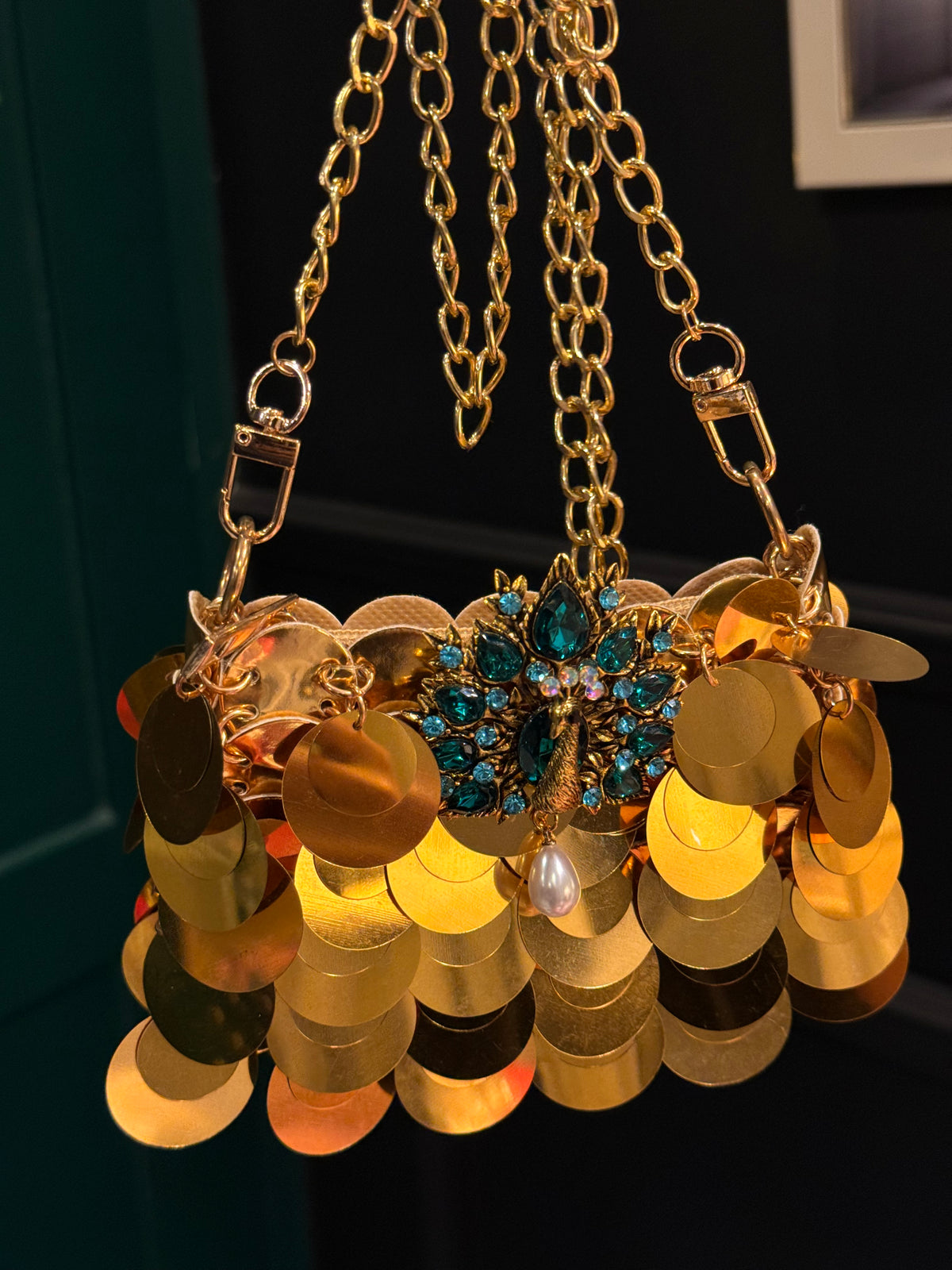 Gold faux sequin mini clutch with peacock embellishments