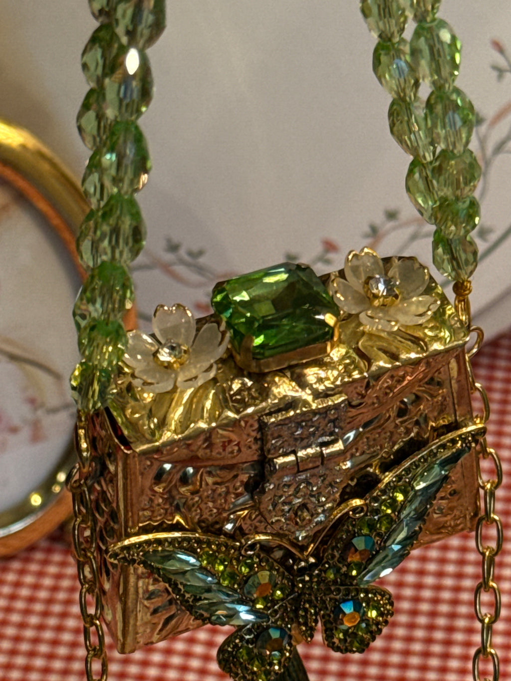 Gold leather clutch with bow embellishments