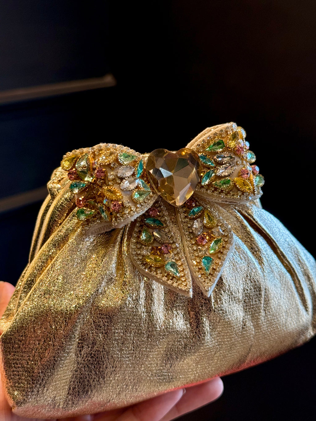 Gold clutch with multi colour bow