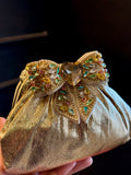 Gold clutch with multi colour bow