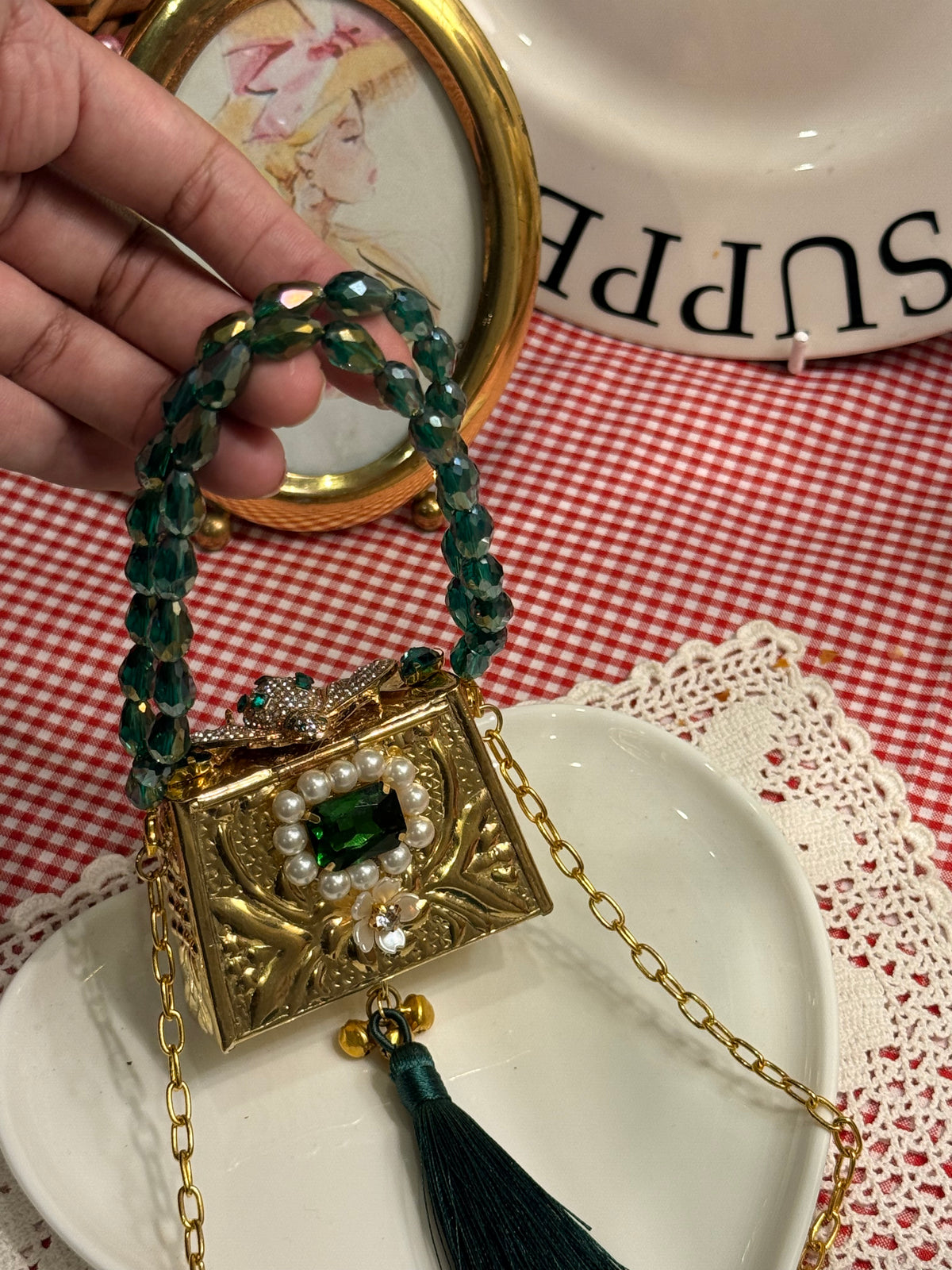 Green bug clutch with tassel