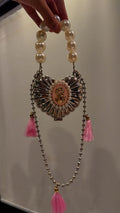 Metal heart clutch with pink embellishments