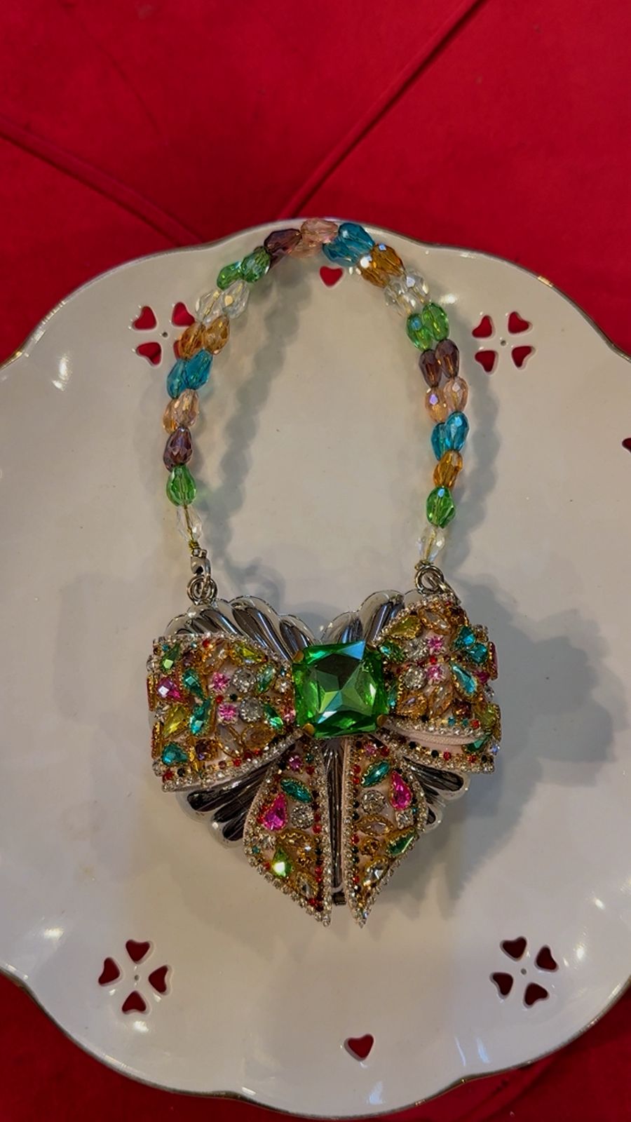 Silver base clutch with multi embellished bow