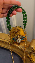 Mini nano clutch with green bug embellishments