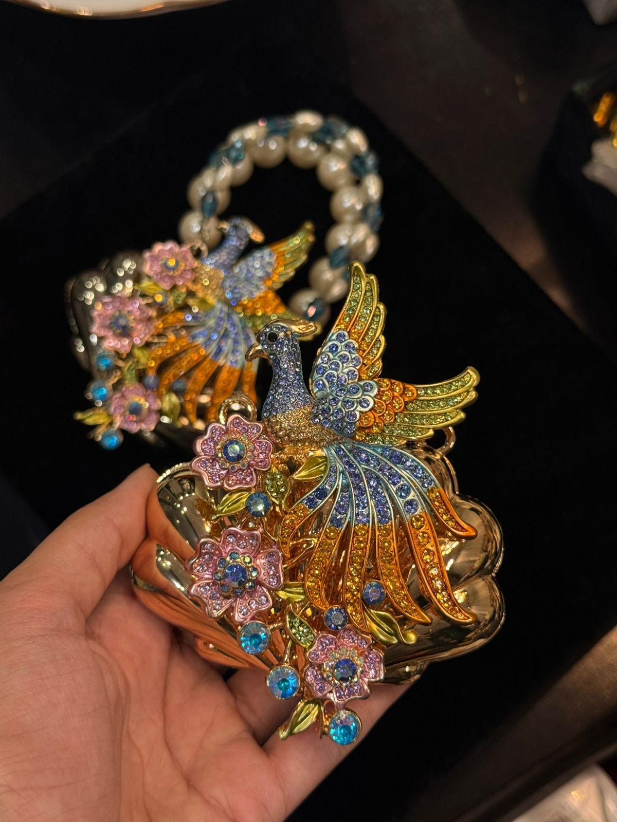 Peacock clutch