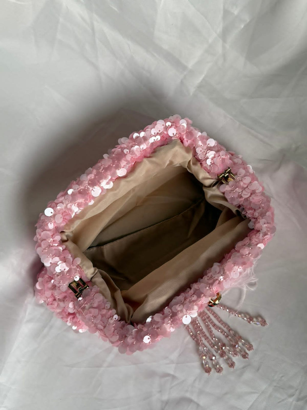 Pink sequin clutch with flamingo