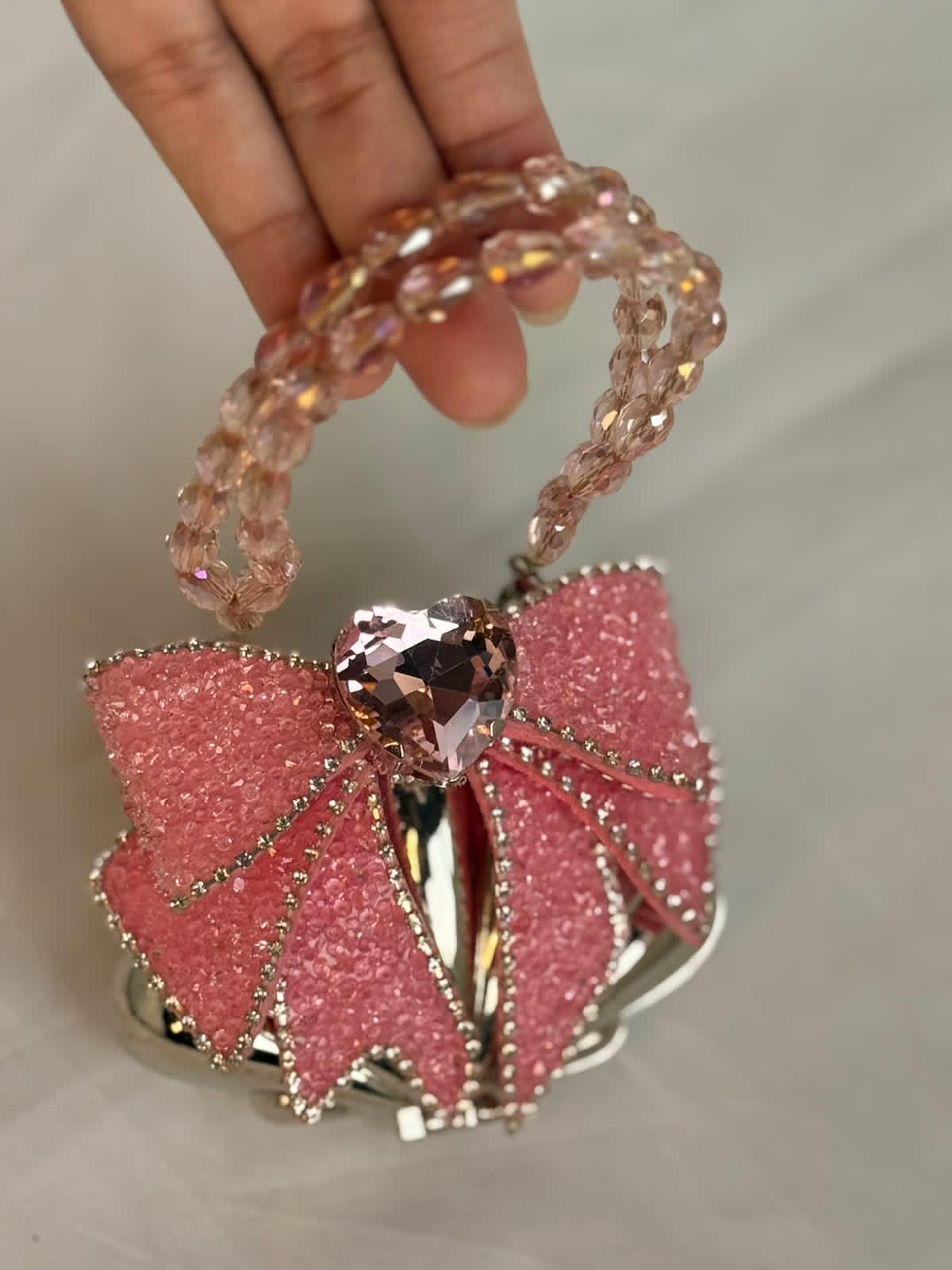 Silver base with pink embellished bow