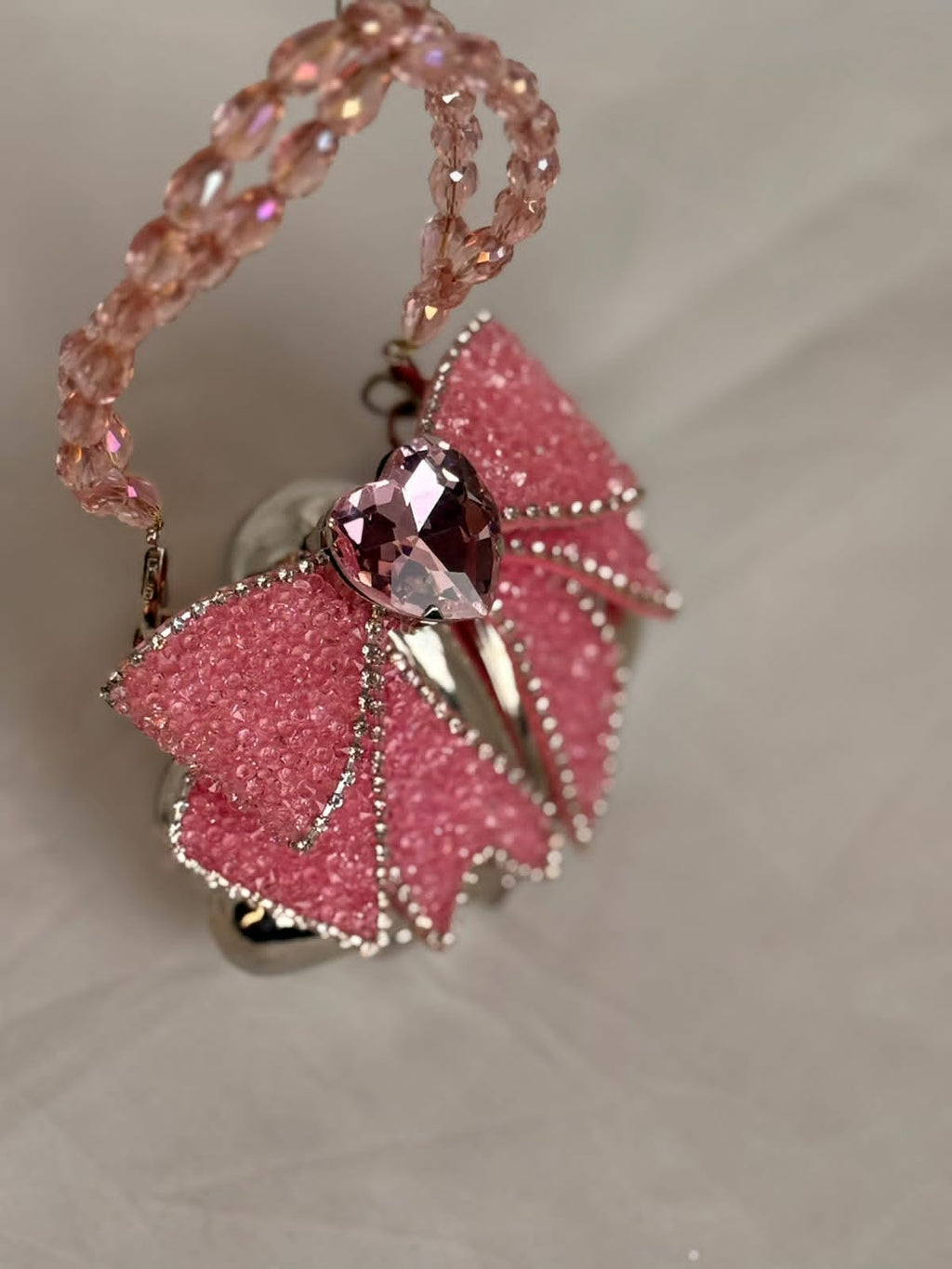 Silver base with pink embellished bow
