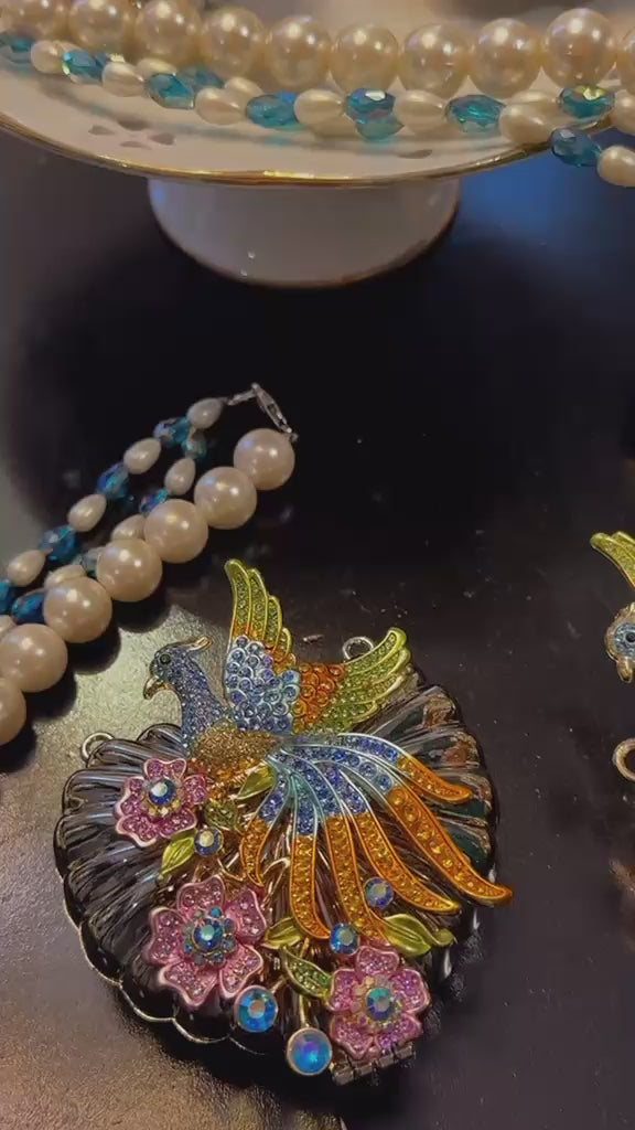 Peacock clutch